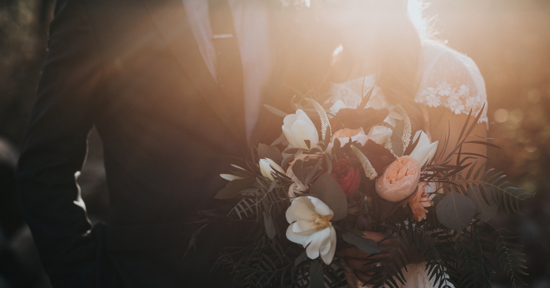 A person and person holding flowers
