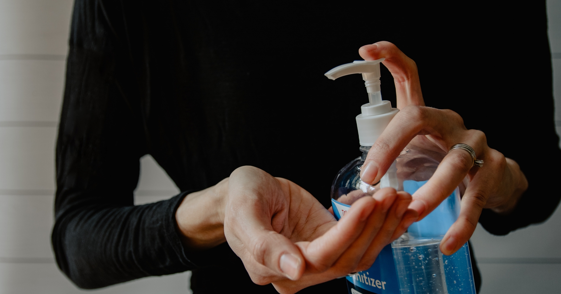 A person using a pump of alcohol