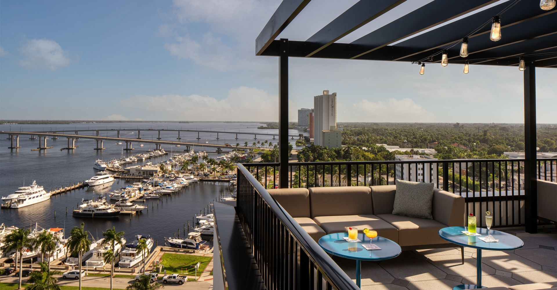 A balcony with a view of a city and water