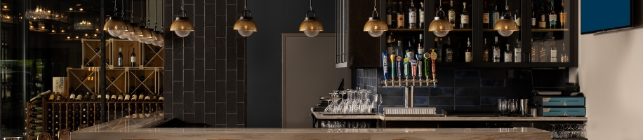 A bar with chairs and a counter