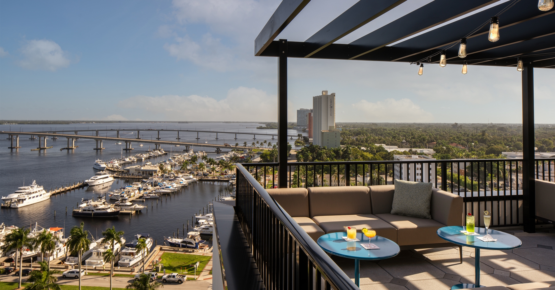 A balcony with a view of a city and water