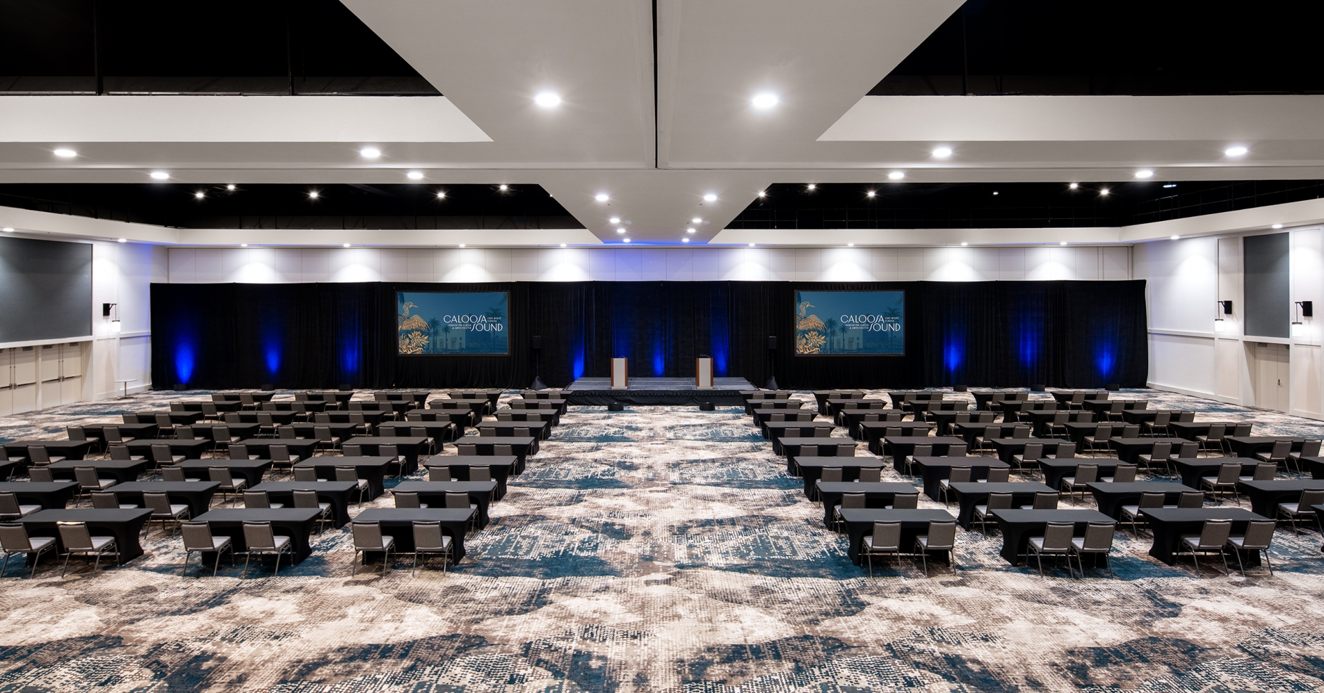 A room with tables and a blue light