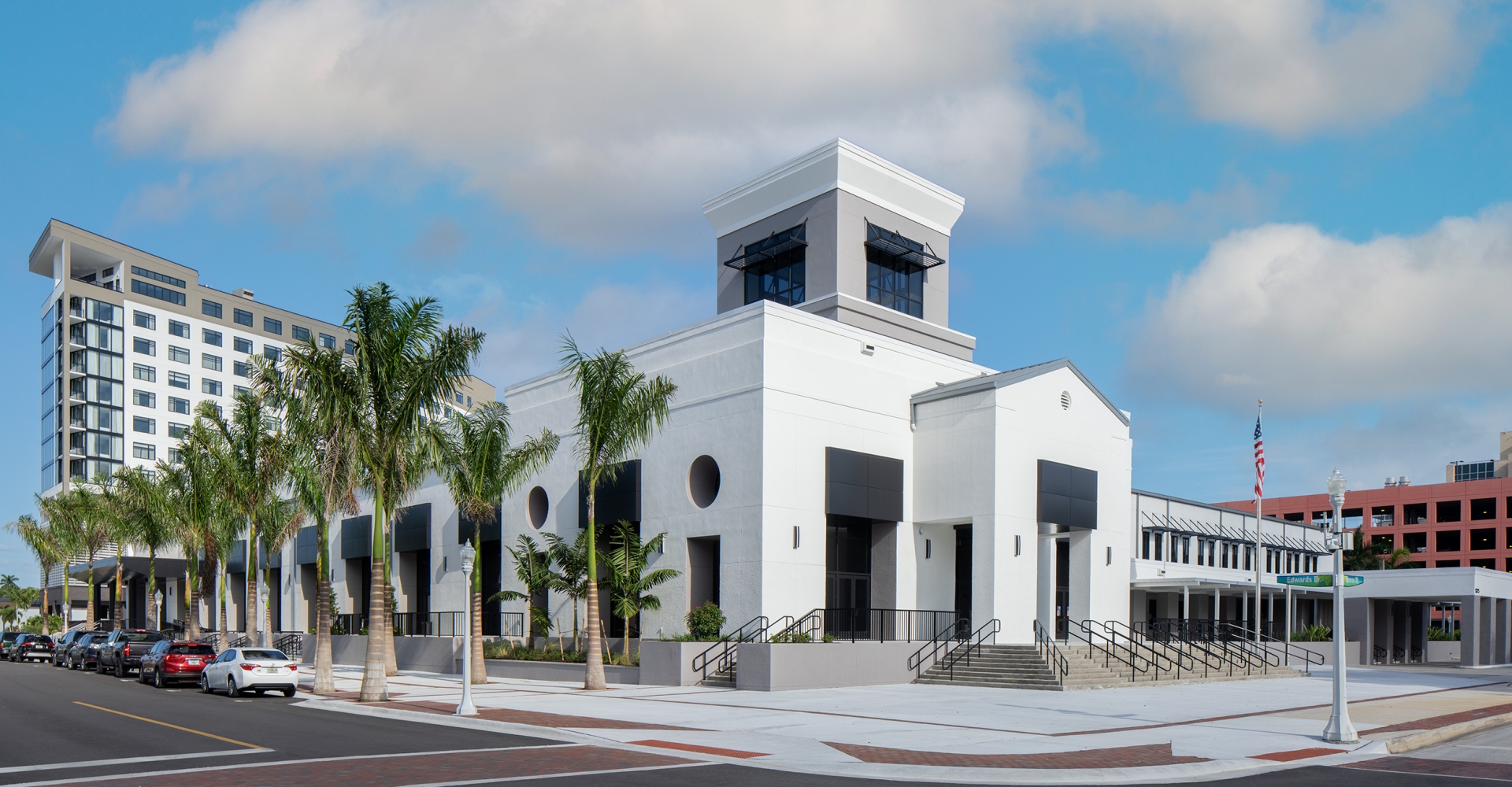 A white building with palm trees