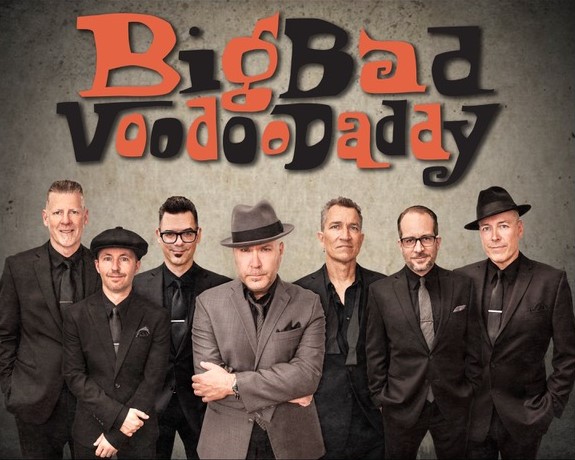 A group of men posing for a photo