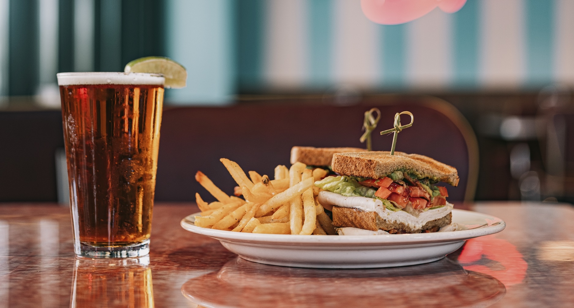 A plate of food and a glass of beer