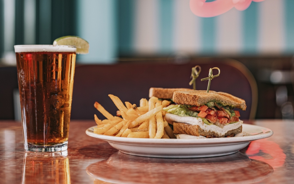 A plate of food and a glass of beer