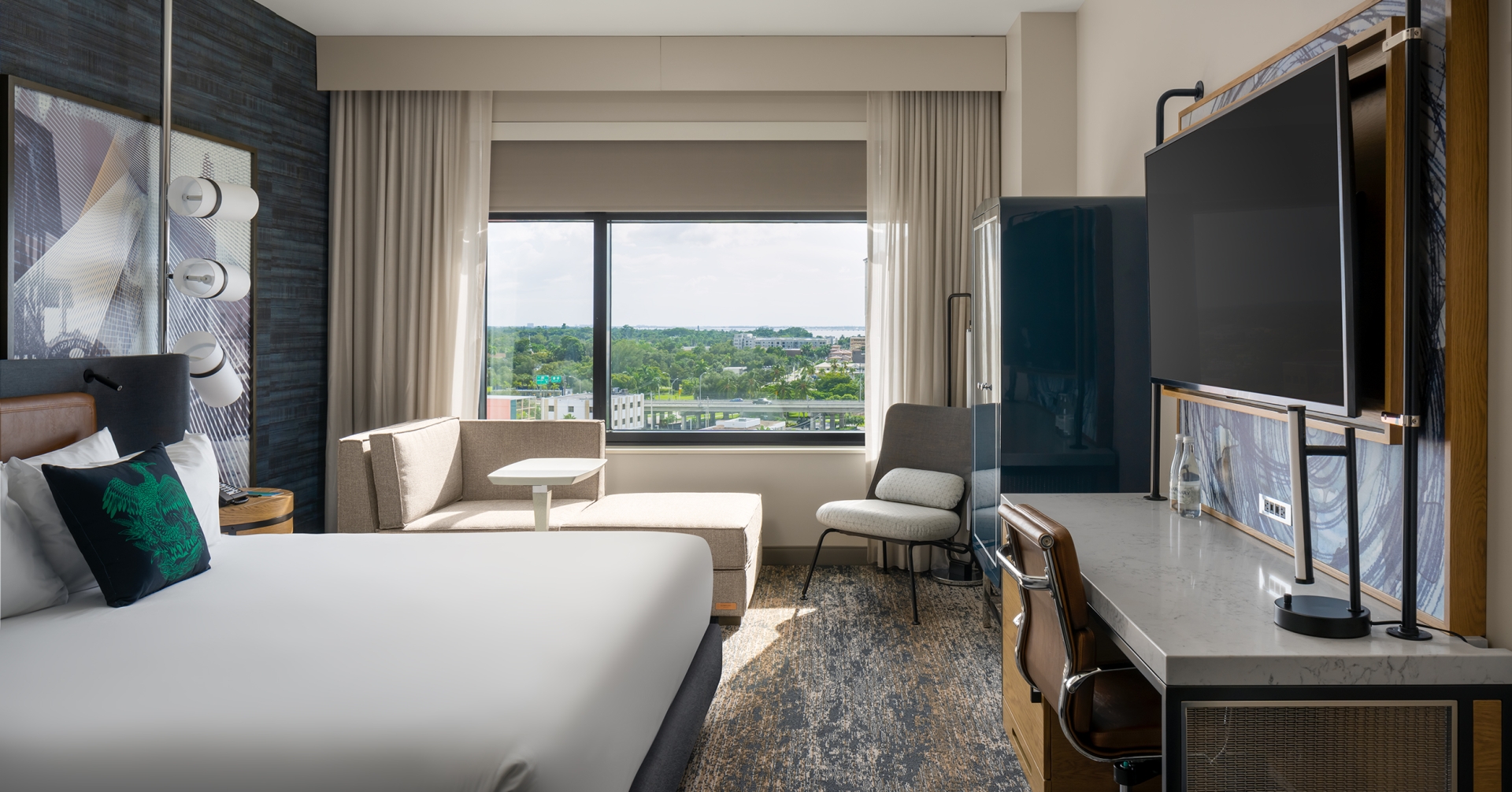 A room with a bed and a television