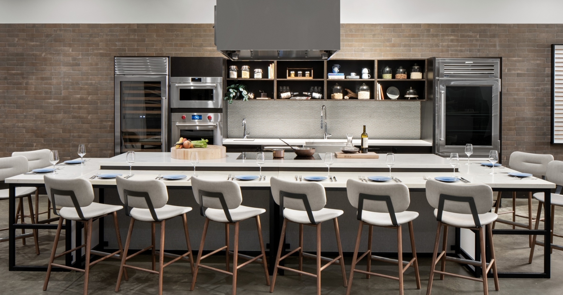 A large kitchen with a large island and chairs